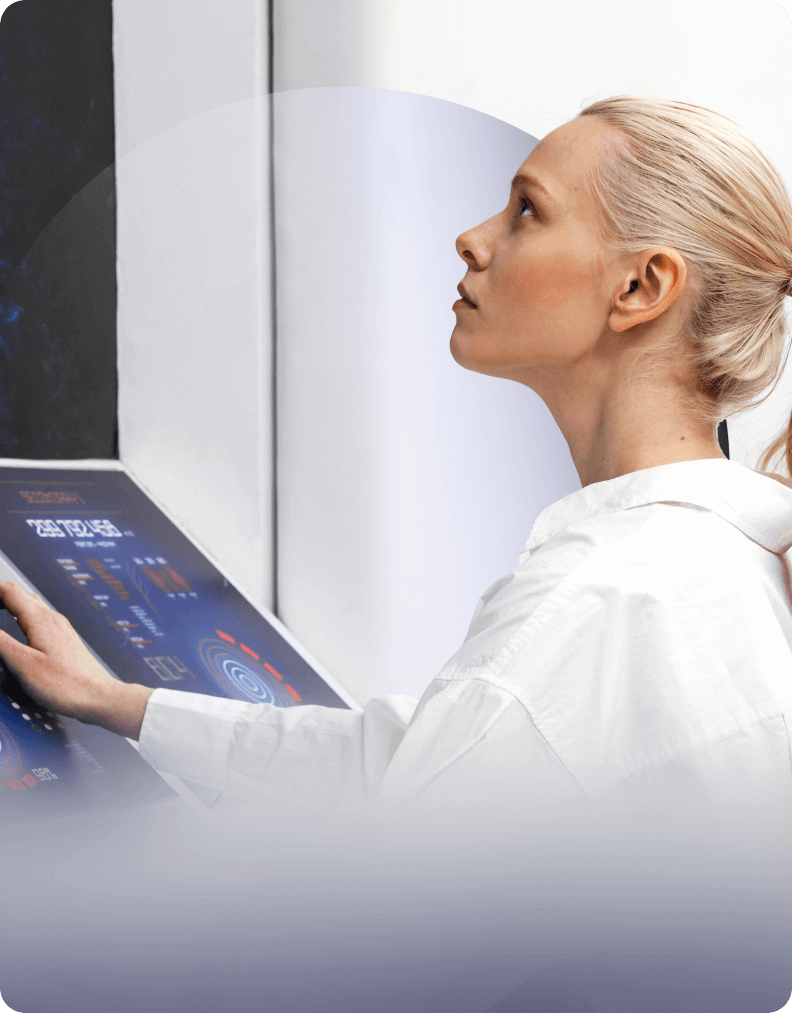 Female healthcare professional interacting with a digital medical interface, representing smart health tech solutions.