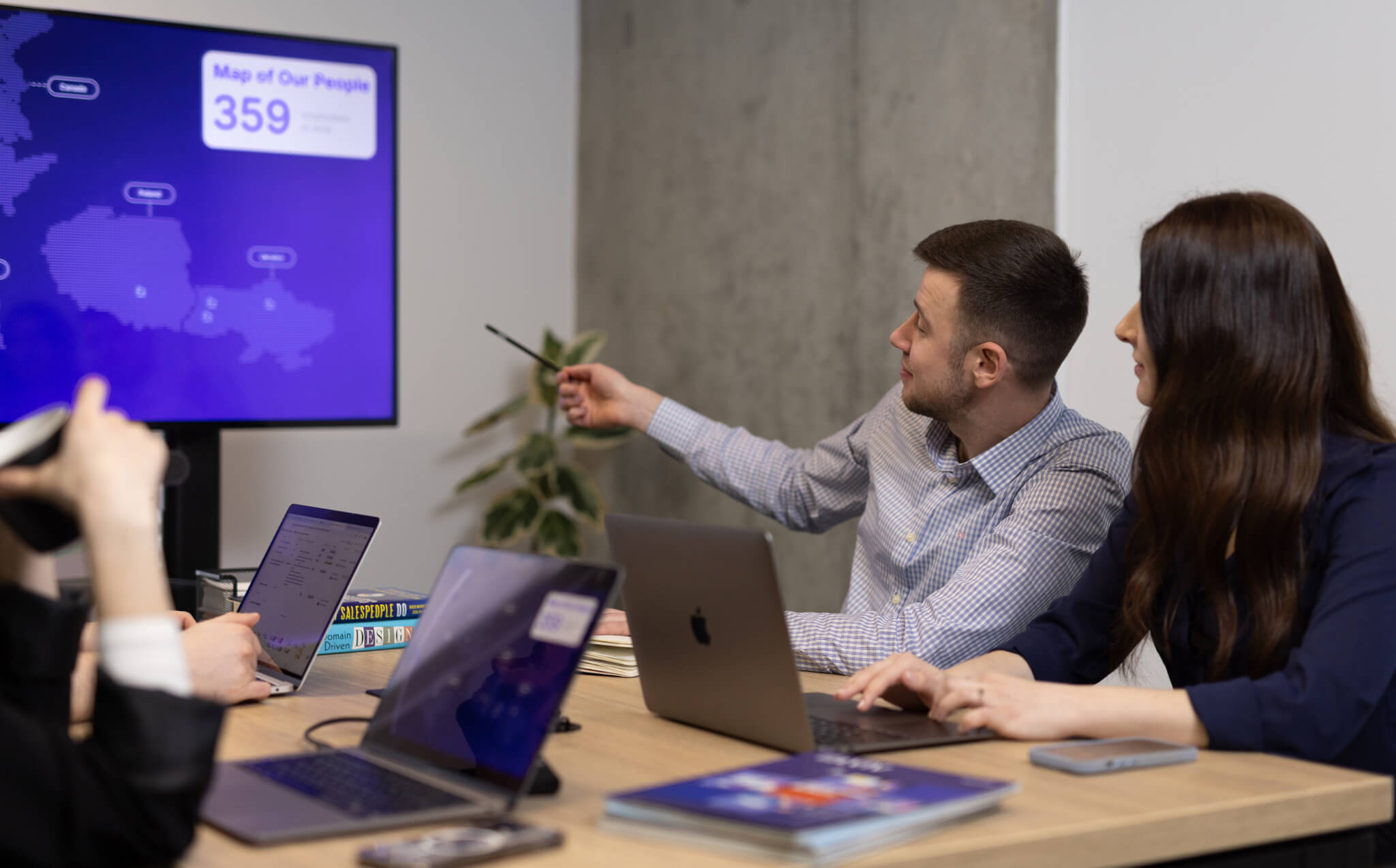 Team member presenting Sombra’s global presence and delivery footprint, highlighting the company’s commitment to exceptional service in 2025.