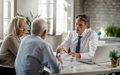 Elderly couple consulting with a financial advisor